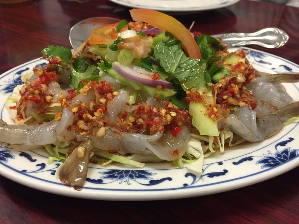 Raw shrimp salad topped with chili, garlic and herbs